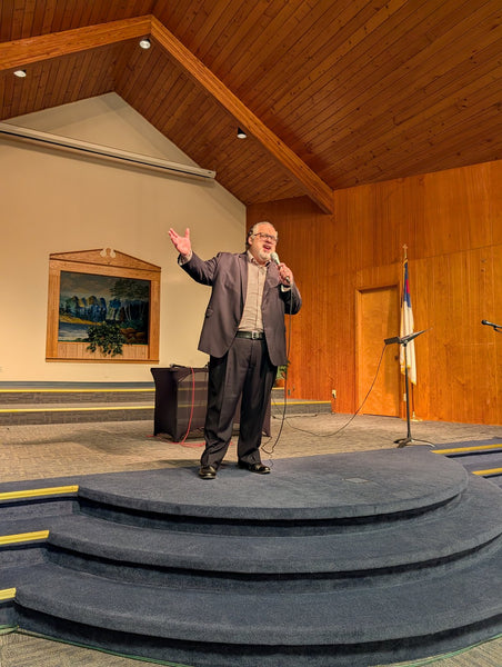 Ministering in a small wood-panelled church